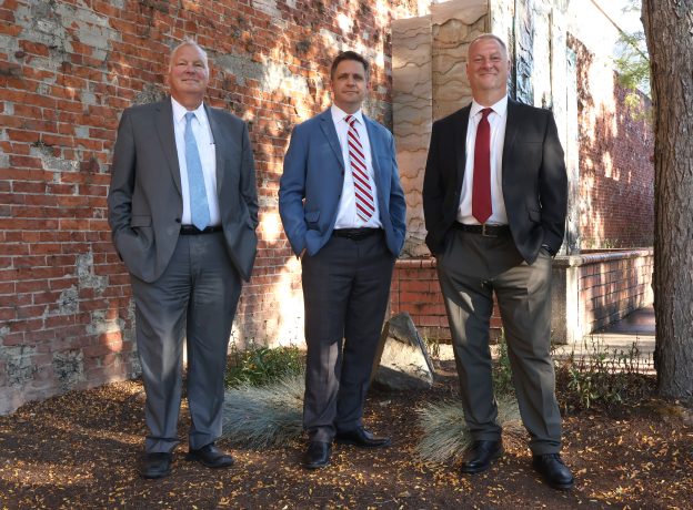 three attorneys outside
